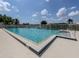 Community pool with lounge chairs at 651 Lakescene Dr, Venice, FL 34293