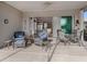 Relaxing screened patio with seating area overlooking backyard at 651 Lakescene Dr, Venice, FL 34293