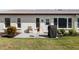 Private backyard patio with grill and seating area at 664 Linden Dr, Englewood, FL 34223