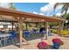 Relaxing community gazebo with tables and grill at 664 Linden Dr, Englewood, FL 34223