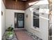 Inviting entryway with decorative accents and plants at 664 Linden Dr, Englewood, FL 34223