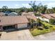Two-bedroom villa with attached garage and nicely landscaped yard at 664 Linden Dr, Englewood, FL 34223