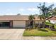 Cute two-bedroom villa with attached garage and nicely landscaped yard at 664 Linden Dr, Englewood, FL 34223