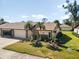 Attractive single-story home with landscaped yard and two-car garage at 664 Linden Dr, Englewood, FL 34223