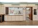 Community kitchen with ample counter space and appliances at 664 Linden Dr, Englewood, FL 34223
