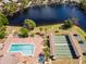 Community pool, hot tub, and shuffleboard courts at 664 Linden Dr, Englewood, FL 34223
