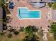Community pool and hot tub with surrounding lounge chairs at 664 Linden Dr, Englewood, FL 34223
