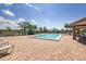 Inviting community pool with lounge chairs and shaded seating at 664 Linden Dr, Englewood, FL 34223