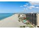 An aerial view of the complex showcasing the pool, beach access and the beachfront location at 840 The Esplanade N # 104, Venice, FL 34285
