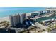 Aerial view of a tall condominium building near the beach and a marina at 840 The Esplanade N # 104, Venice, FL 34285