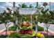 Beautiful view of landscaped entrance and street with lush greenery and vibrant flowers near the real estate at 840 The Esplanade N # 104, Venice, FL 34285
