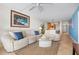 Bright living room with comfy seating and ocean view at 840 The Esplanade N # 104, Venice, FL 34285