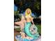 Mermaid statue that features seashells and a starfish at 840 The Esplanade N # 104, Venice, FL 34285