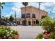 Stunning street view with unique architecture, landscaping, and colorful flower arrangements near available real estate at 840 The Esplanade N # 104, Venice, FL 34285