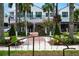 Street view of the businesses and landscaping for an overview of the community real estate at 840 The Esplanade N # 104, Venice, FL 34285