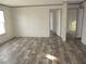 Bright and spacious living room with wood-look flooring at 8426 Sweden Blvd, Punta Gorda, FL 33982