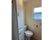 Small bathroom with toilet and built-in storage at 863 Baveno Dr, Venice, FL 34285