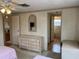 Bedroom with dresser, mirror, and access to bathroom at 863 Baveno Dr, Venice, FL 34285