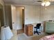 Bedroom with desk, dresser and access to hallway at 863 Baveno Dr, Venice, FL 34285