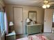 Bedroom with dresser, nightstand and closet at 863 Baveno Dr, Venice, FL 34285