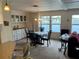 Dining room with lake view, chandelier, and seating for four at 863 Baveno Dr, Venice, FL 34285