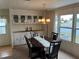 Dining area with built-in hutch and seating for four at 863 Baveno Dr, Venice, FL 34285