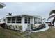 Single-wide manufactured home with a side view at 863 Baveno Dr, Venice, FL 34285