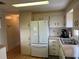 Kitchen with white cabinets and built in microwave at 863 Baveno Dr, Venice, FL 34285