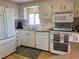 White kitchen with appliances and ample counter space at 863 Baveno Dr, Venice, FL 34285
