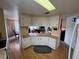 Kitchen features a large counter and white cabinets at 863 Baveno Dr, Venice, FL 34285