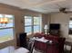 Living room with water view and maroon couch at 863 Baveno Dr, Venice, FL 34285
