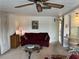 Living room with sofa, coffee table, and ceiling fan at 863 Baveno Dr, Venice, FL 34285
