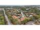 Aerial view of a community with numerous houses, parking lots, and lush greenery at 958 Sunridge Dr # H3, Sarasota, FL 34234
