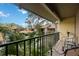 Relaxing balcony overlooking lush landscaping and community at 958 Sunridge Dr # H3, Sarasota, FL 34234