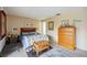 Cozy bedroom with a comfortable bed and dresser at 958 Sunridge Dr # H3, Sarasota, FL 34234