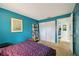 Bedroom with teal walls and built in closet at 958 Sunridge Dr # H3, Sarasota, FL 34234