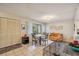Cozy dining area with table, chairs, and access to kitchen at 958 Sunridge Dr # H3, Sarasota, FL 34234