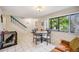 Bright dining area with table and chairs, and view to kitchen at 958 Sunridge Dr # H3, Sarasota, FL 34234