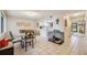 Casual dining area with table and chairs, view to kitchen at 958 Sunridge Dr # H3, Sarasota, FL 34234