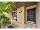 Condo entrance with black door and festive wreath at 958 Sunridge Dr # H3, Sarasota, FL 34234