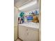 Laundry room with washer, dryer and shelving at 958 Sunridge Dr # H3, Sarasota, FL 34234