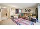 Living room with brown couch and access to patio at 958 Sunridge Dr # H3, Sarasota, FL 34234