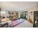 Living room with brown couch, and access to patio at 958 Sunridge Dr # H3, Sarasota, FL 34234