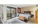 Main bedroom with a queen-size bed and balcony access at 958 Sunridge Dr # H3, Sarasota, FL 34234