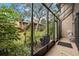 Screened-in patio area with lush landscaping views at 958 Sunridge Dr # H3, Sarasota, FL 34234