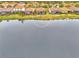 Aerial view showcasing home's location and community lakefront setting at 9895 Wingood Dr, Venice, FL 34292