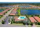 Aerial view of Watercrest community with lake and pool at 9895 Wingood Dr, Venice, FL 34292