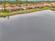 Aerial view of lakefront community, highlighting the waterfront properties at 9895 Wingood Dr, Venice, FL 34292
