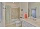 Clean bathroom with shower/tub combo and updated vanity at 9895 Wingood Dr, Venice, FL 34292