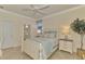 Charming bedroom with white furniture and light blue bedding at 9895 Wingood Dr, Venice, FL 34292